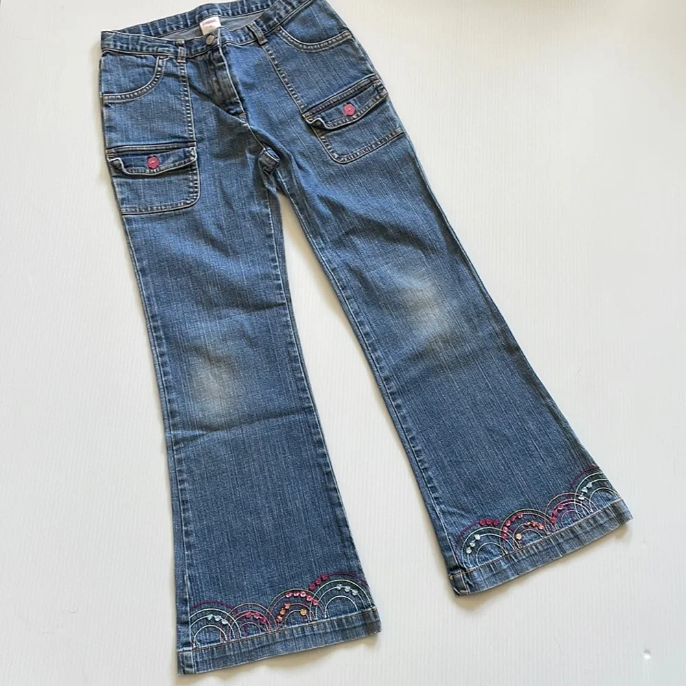 Flared Gymboree jeans with rainbow stitching & beading.  Girls size 9